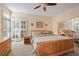 Serene primary bedroom with natural light, shutters, and mirror-door closet at 230 Ridge Point Ct, Alpharetta, GA 30022
