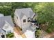Aerial view of the home showing the yard, driveway, landscaping and surrounding neighborhood at 253 Rockyford Ne Rd, Atlanta, GA 30317