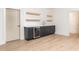 Stylish bar area features a sleek cabinet with a wine cooler and modern shelving at 253 Rockyford Ne Rd, Atlanta, GA 30317