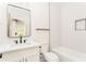 Modern bathroom features a large mirror, stylish vanity, soaking tub, and sleek black hardware at 253 Rockyford Ne Rd, Atlanta, GA 30317