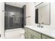 Bathroom with a vanity, grey tile and shower-tub combo at 253 Rockyford Ne Rd, Atlanta, GA 30317