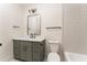 Modern bathroom with a gray vanity, sleek mirror, and stylish tile accents at 253 Rockyford Ne Rd, Atlanta, GA 30317