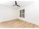 Bright bedroom with a ceiling fan and a large window providing natural light at 253 Rockyford Ne Rd, Atlanta, GA 30317