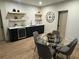 Elegant dining area with a glass table, bar and wine fridge, perfect for entertaining guests at 253 Rockyford Ne Rd, Atlanta, GA 30317