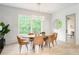 Well lit dining room with designer light fixture and a large window view at 253 Rockyford Ne Rd, Atlanta, GA 30317