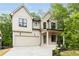 Stunning two-story home boasting a neutral palette, black trim windows, a covered front porch, and an attached two-car garage at 253 Rockyford Ne Rd, Atlanta, GA 30317