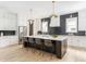 Contemporary kitchen boasts an island with seating and stainless steel appliances at 253 Rockyford Ne Rd, Atlanta, GA 30317