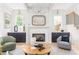 Cozy living room with fireplace, accent furniture, and natural light at 253 Rockyford Ne Rd, Atlanta, GA 30317