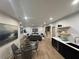 Spacious living room with modern decor, a dining area, and a bar with a wine cooler at 253 Rockyford Ne Rd, Atlanta, GA 30317