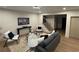 Comfortable living room with modern furniture, sleek lighting and stairs in the background at 253 Rockyford Ne Rd, Atlanta, GA 30317