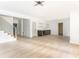 Spacious living room features a bar with modern shelving, hardwood floors, and a staircase at 253 Rockyford Ne Rd, Atlanta, GA 30317