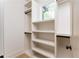 Custom walk-in closet with built-in shelving and hanging rods, designed for optimal storage at 253 Rockyford Ne Rd, Atlanta, GA 30317