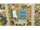 Aerial view of a community pool and tennis courts, highlighting the recreational amenities available to residents at 3477 Seneca Farm Dr, Buford, GA 30519