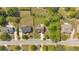 A bird's-eye view of a quiet, tree-lined street featuring neatly arranged homes, showcasing a serene and well-kept neighborhood at 3477 Seneca Farm Dr, Buford, GA 30519