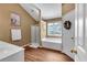 Bright bathroom featuring a soaking tub, walk-in shower, and vanity with ample storage space at 3477 Seneca Farm Dr, Buford, GA 30519