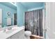 Bathroom featuring a modern vanity with granite countertop and a shower with flower-designed curtain at 3477 Seneca Farm Dr, Buford, GA 30519
