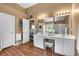 Bathroom with double sinks, a vanity area, a large mirror, and plenty of counter space at 3477 Seneca Farm Dr, Buford, GA 30519