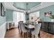 Dining room featuring a chandelier, ample seating, and decor that enhances the room's welcoming atmosphere at 3477 Seneca Farm Dr, Buford, GA 30519