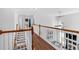 Open foyer with hardwood floors and a staircase, offering a glimpse into the home's airy and bright layout at 3477 Seneca Farm Dr, Buford, GA 30519
