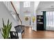 Bright foyer with hardwood floors, high ceilings, and natural light streaming through the front door at 3477 Seneca Farm Dr, Buford, GA 30519
