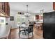 Eat-in kitchen featuring dining area, stainless appliances, and access to outdoor patio at 3477 Seneca Farm Dr, Buford, GA 30519