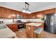 Kitchen featuring stainless steel oven, microwave, and hardwood floors with center island and seating at 3477 Seneca Farm Dr, Buford, GA 30519
