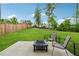 Spacious backyard with lush lawn, patio, and fire pit, great for outdoor entertaining at 4777 Waxwing St, Hoschton, GA 30548