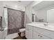 Modern bathroom featuring a vanity with a white countertop and a combination shower and bathtub at 4777 Waxwing St, Hoschton, GA 30548