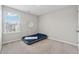 A simple bedroom with grey carpet, a window and an air mattress at 4777 Waxwing St, Hoschton, GA 30548