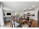 Open floor plan featuring a dining area, living room, and kitchen with stainless steel appliances at 4777 Waxwing St, Hoschton, GA 30548