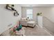Cozy loft space with carpet, a chair and ottoman, and natural light at 4777 Waxwing St, Hoschton, GA 30548