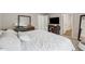 Bright main bedroom with a large bed, carpeted floors, and a tv mounted on the wall at 4777 Waxwing St, Hoschton, GA 30548