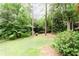 Lush backyard featuring mature trees and greenery, offering a private and serene outdoor space at 2227 Leafmore Drive, Decatur, GA 30033