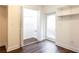 Bright basement featuring vinyl floors, shelving, and a walk-out entrance at 2227 Leafmore Drive, Decatur, GA 30033