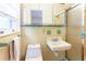 Retro bathroom featuring a toilet, sink, shower, and vintage-inspired decor at 2227 Leafmore Drive, Decatur, GA 30033