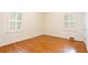 Cozy bedroom with hardwood floors and windows showcasing ample natural light at 2227 Leafmore Drive, Decatur, GA 30033