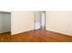 Bedroom with hardwood floors leading to closet space and an open doorway at 2227 Leafmore Drive, Decatur, GA 30033