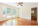 Light-filled bedroom with hardwood floors, ceiling fan, and access to a deck at 2227 Leafmore Drive, Decatur, GA 30033