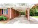 Attached carport featuring brick columns, providing sheltered parking and easy access to the home at 2227 Leafmore Drive, Decatur, GA 30033