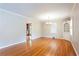 Dining area showcasing hardwood floors, chandelier, and view into the kitchen at 2227 Leafmore Drive, Decatur, GA 30033