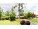 Charming home with mature trees, a green lawn, and convenient carport, blending comfort and curb appeal at 2227 Leafmore Drive, Decatur, GA 30033
