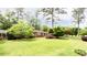 Charming brick home with a well-manicured lawn and mature trees creating a picturesque setting at 2227 Leafmore Drive, Decatur, GA 30033