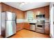 Well-lit kitchen equipped with stainless steel appliances and wooden cabinetry at 2227 Leafmore Drive, Decatur, GA 30033
