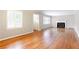 Bright living room featuring hardwood floors, a fireplace, and large windows at 2227 Leafmore Drive, Decatur, GA 30033