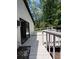 A backyard deck with white railings and a sliding door that leads inside at 3285 Rollingbrook Way, Duluth, GA 30096