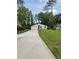 View of the home's front exterior, driveway, and yard at 3285 Rollingbrook Way, Duluth, GA 30096