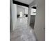 Hallway leading to an open concept living room with a decorative fireplace at 3285 Rollingbrook Way, Duluth, GA 30096
