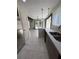 Modern kitchen with stainless steel refrigerator, quartz countertops and light fixtures at 3285 Rollingbrook Way, Duluth, GA 30096