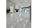 Bright living room with fireplace, white marble tile flooring, and high ceilings at 3285 Rollingbrook Way, Duluth, GA 30096