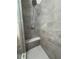Modern shower with gray marble tile walls, shower head and white subway tile floor at 3285 Rollingbrook Way, Duluth, GA 30096